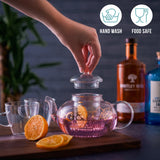 Gin Teekrug aus Glas mit Tassen